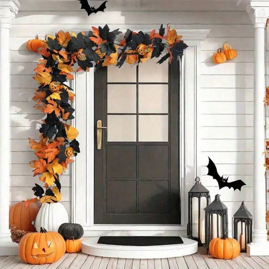 Halloween maple leaf garland framing a white front door