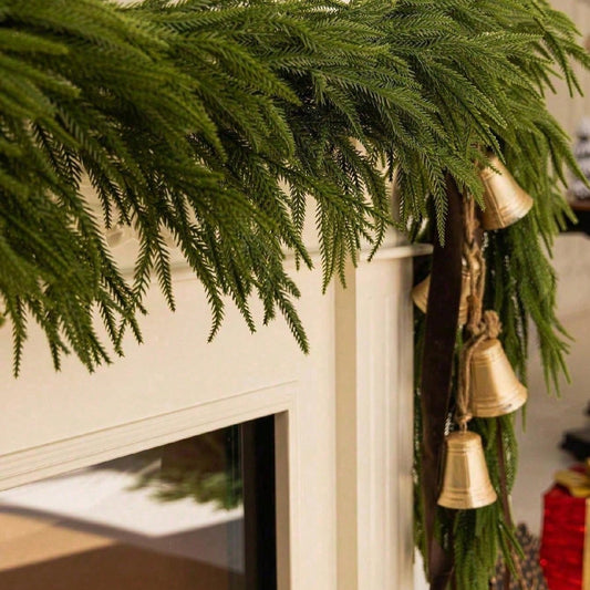 Artificial cedar Christmas swag on a mantel corner, close-up