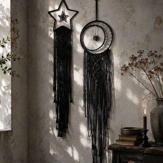Black macrame moon dream catcher close-up in window sunlight