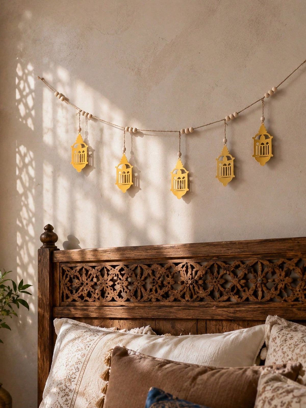 gold filigree lantern garland styled in a room, photo 9