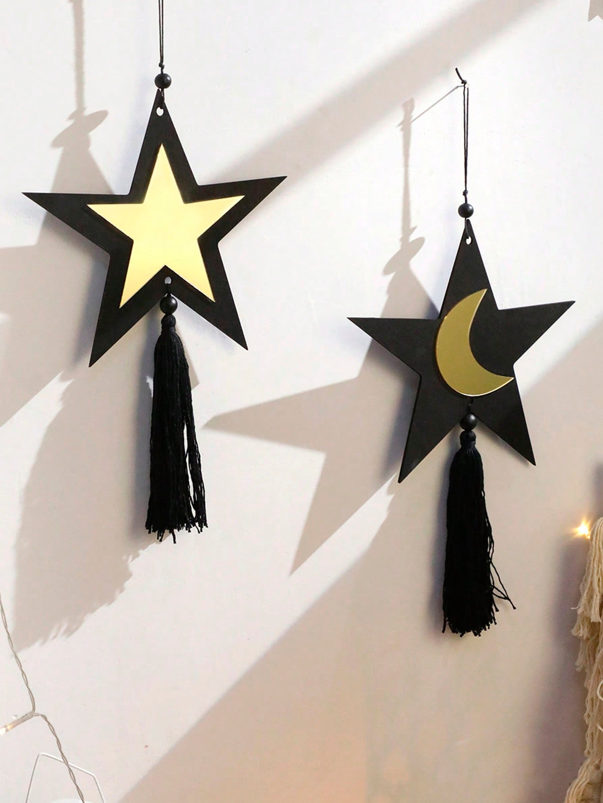 star and crescent tassel wall hanging styled in a room, photo 10