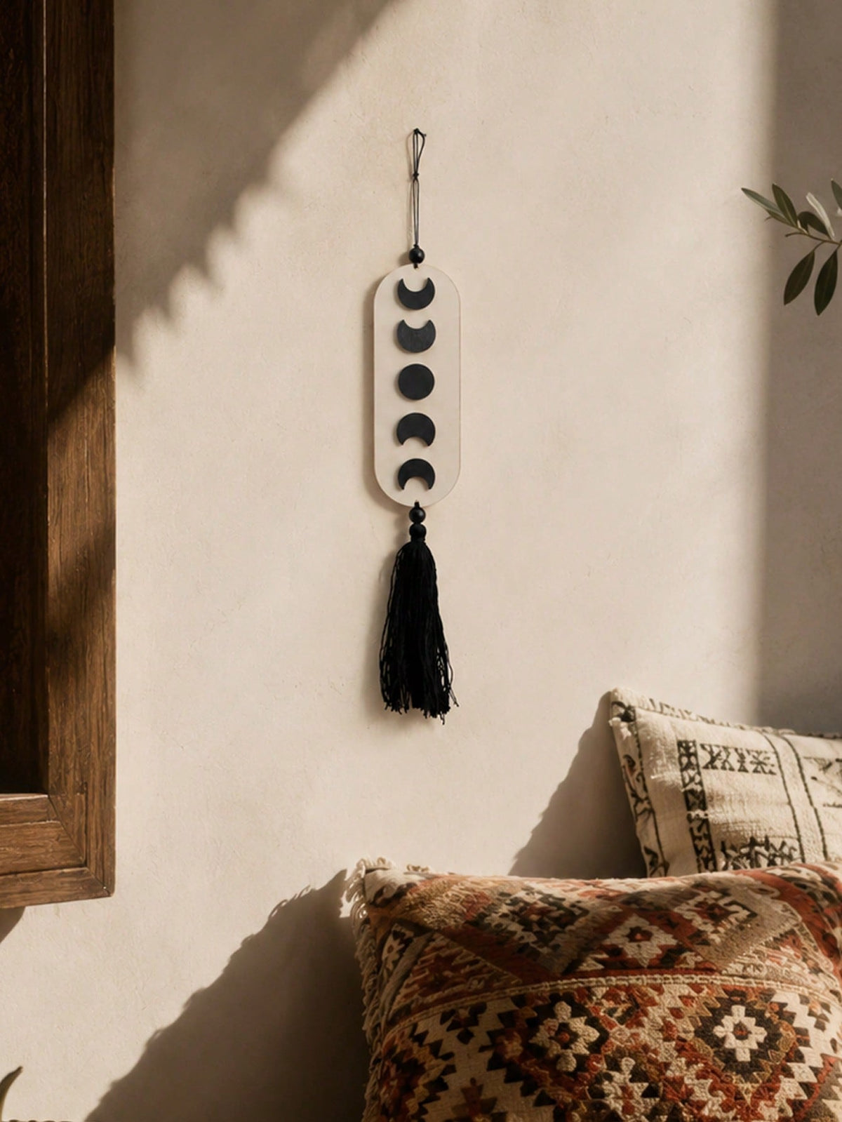 crescent moon phase tassel wall hanging styled in a room, photo 11