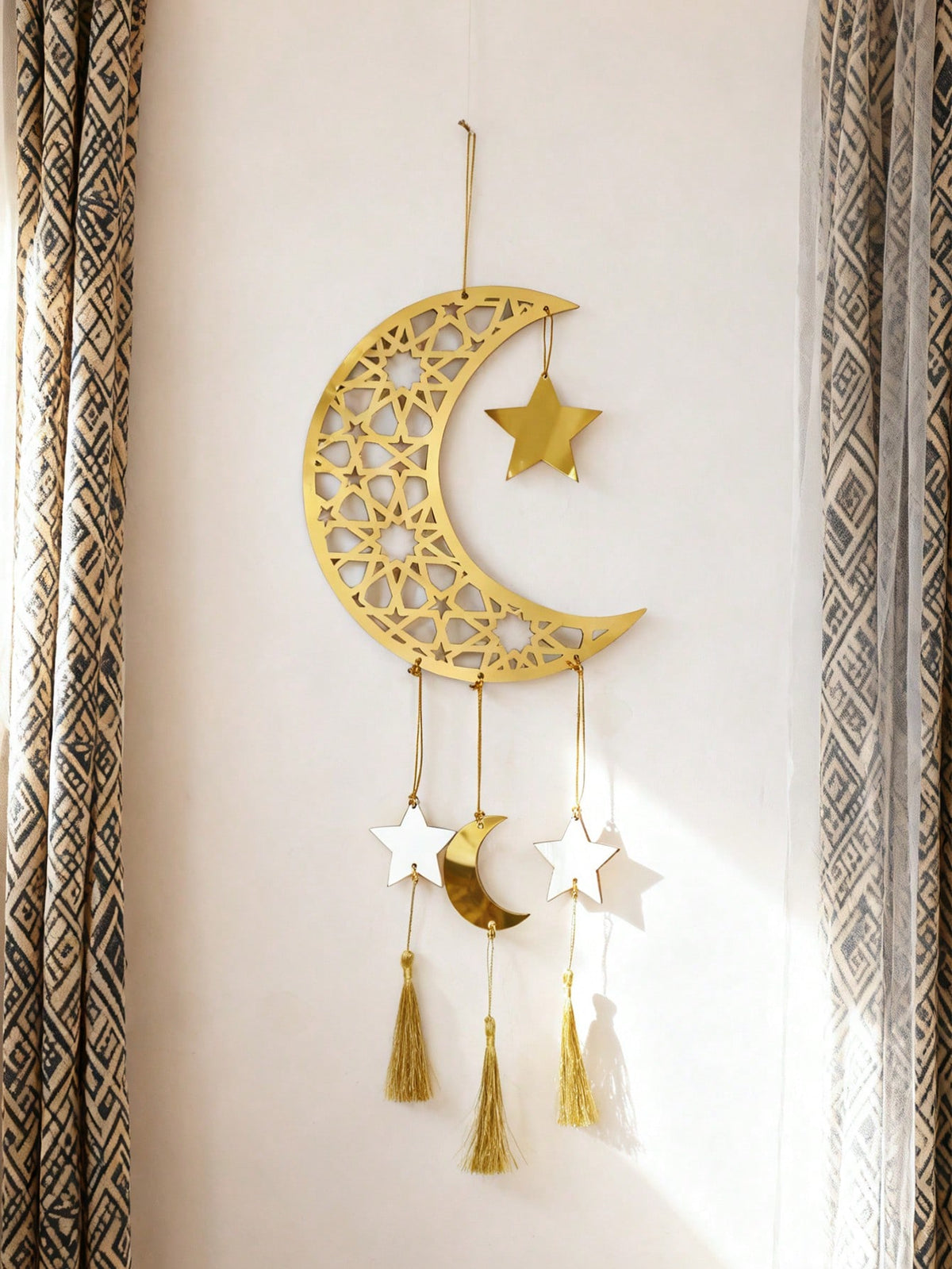 crescent moon star wall hanging with tassels styled in a room, photo 10