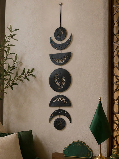 moon phase olive branch wall hanging styled in a room, photo 3