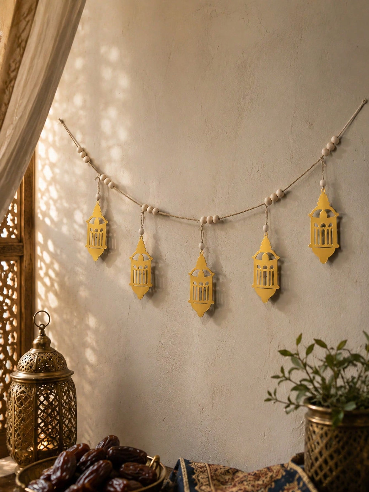 gold geometric lantern garland styled in a room, photo 3