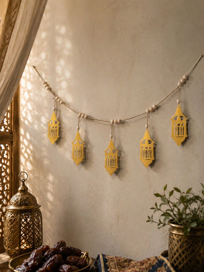 gold geometric lantern garland styled in a room, photo 3