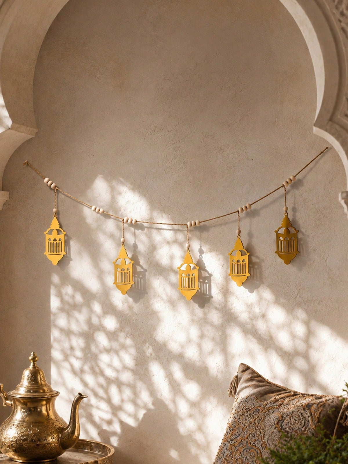 gold filigree lantern garland styled in a room, photo 2