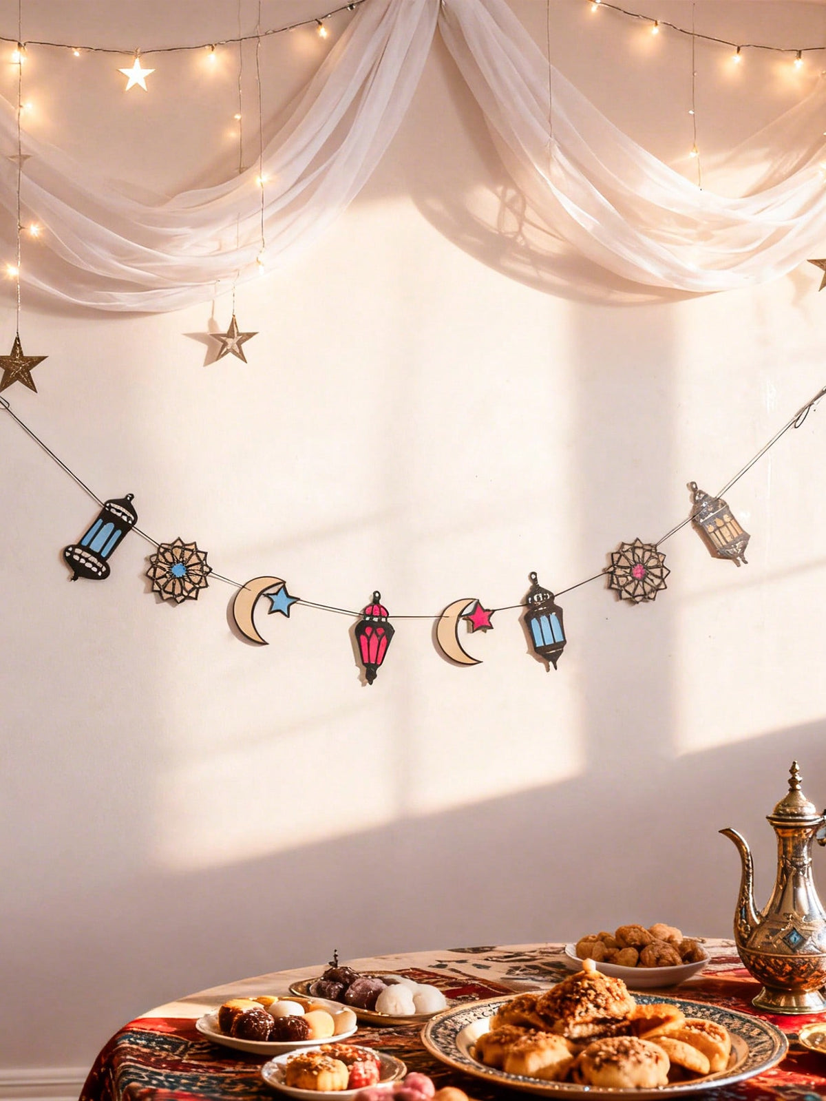 lantern crescent and star garland styled in a room, photo 3