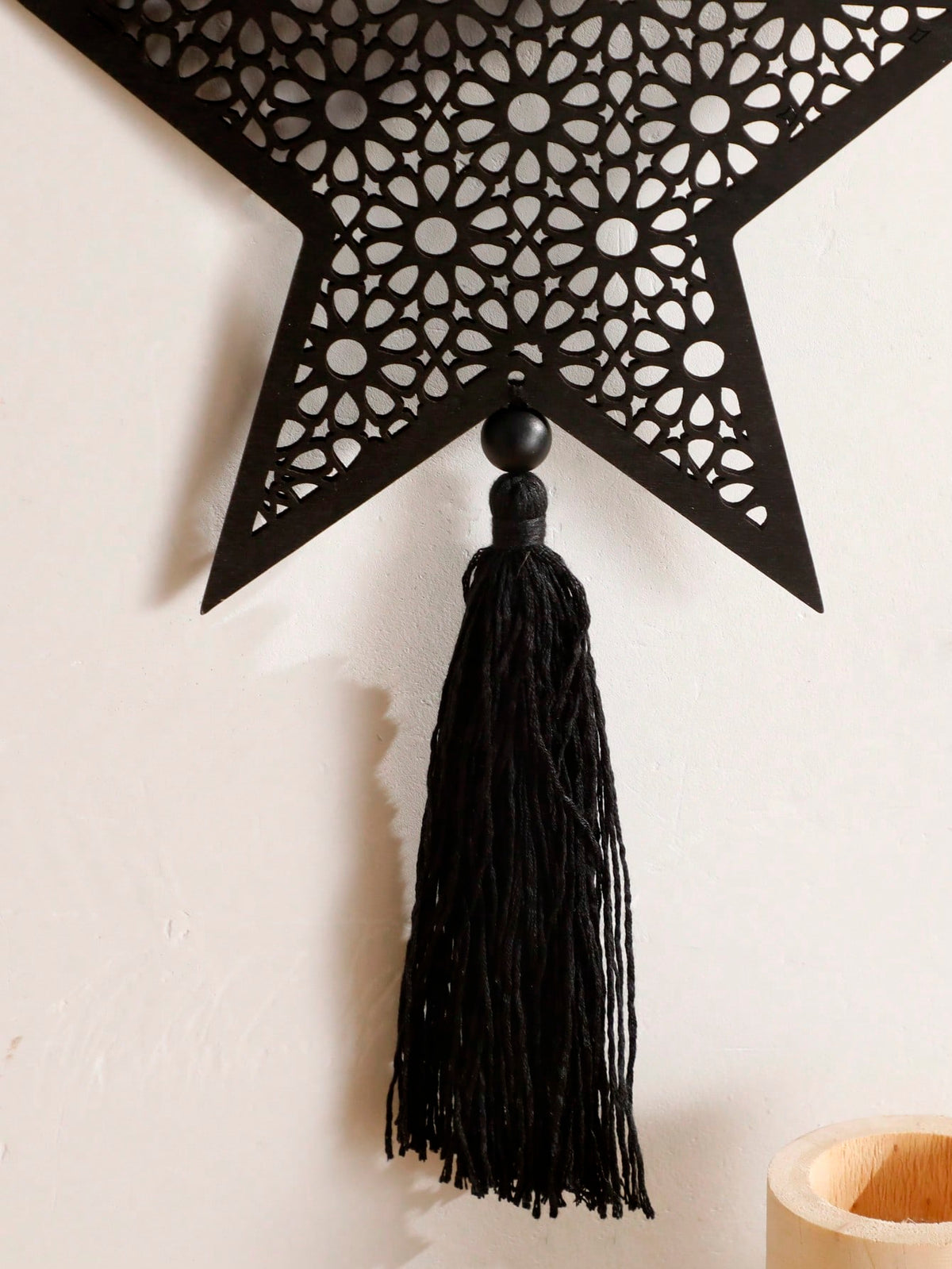 filigree star tassel wall hanging styled in a room, photo 3