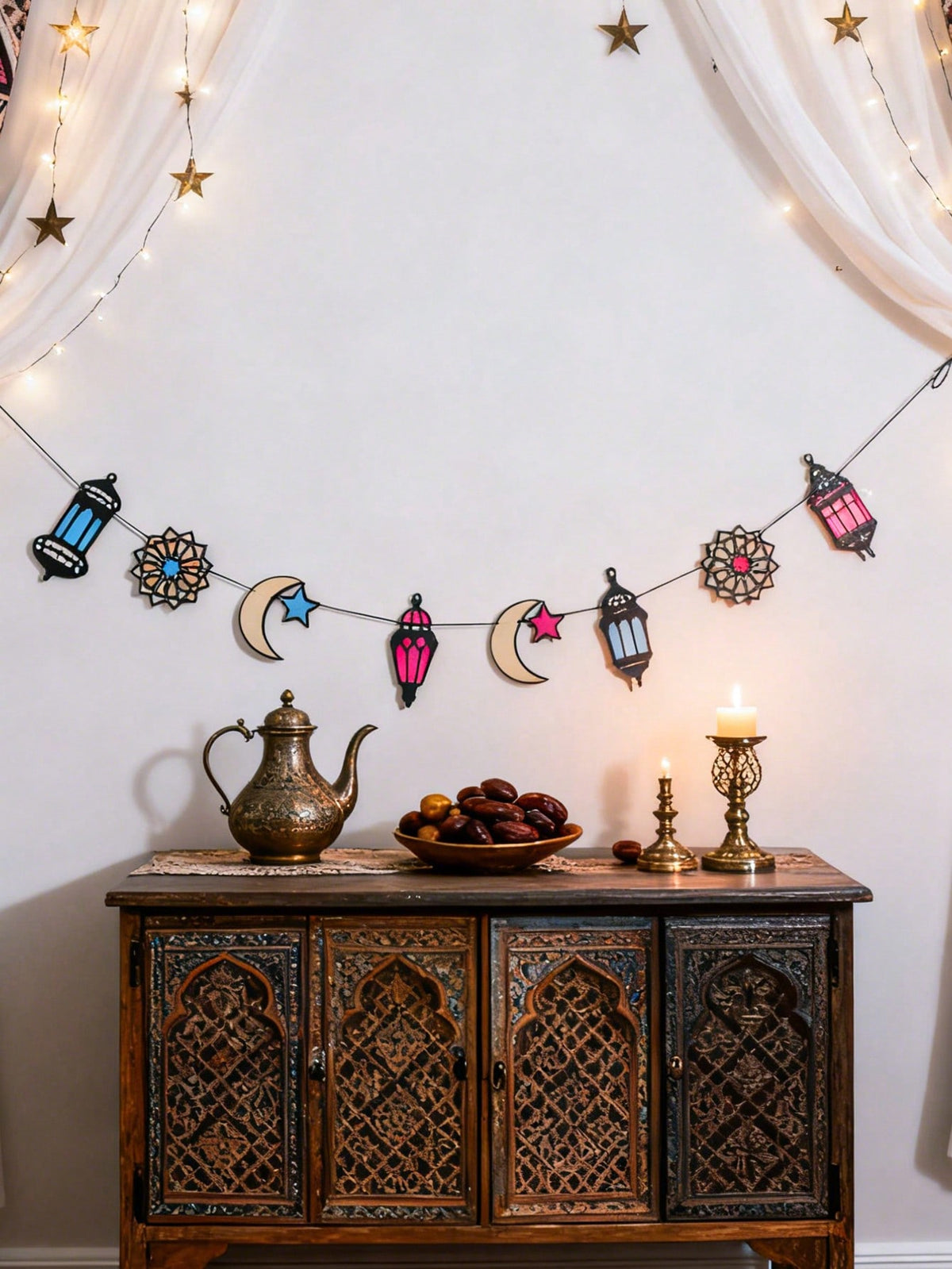 lantern crescent and star garland styled in a room, photo 4
