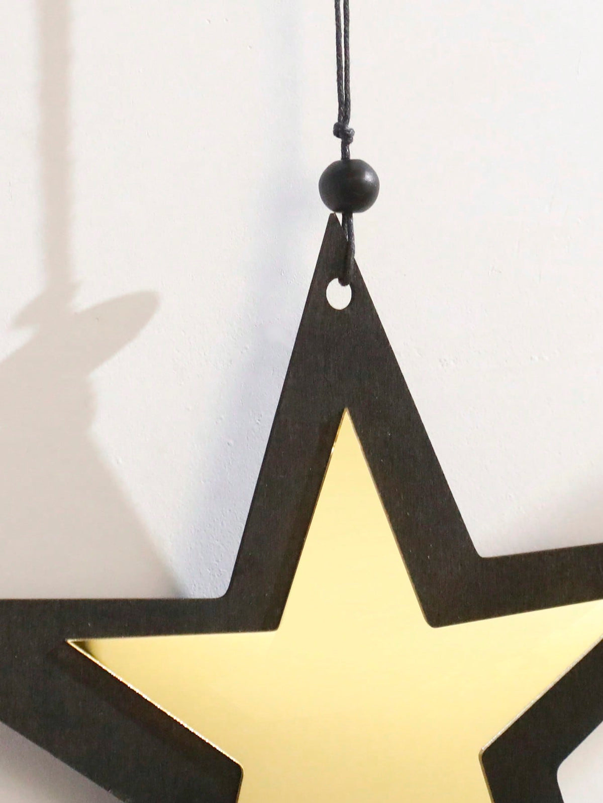 star and crescent tassel wall hanging styled in a room, photo 4