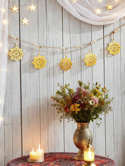 gold eight-point star garland styled in a room, photo 4