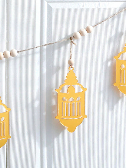 gold filigree lantern garland styled in a room, photo 4