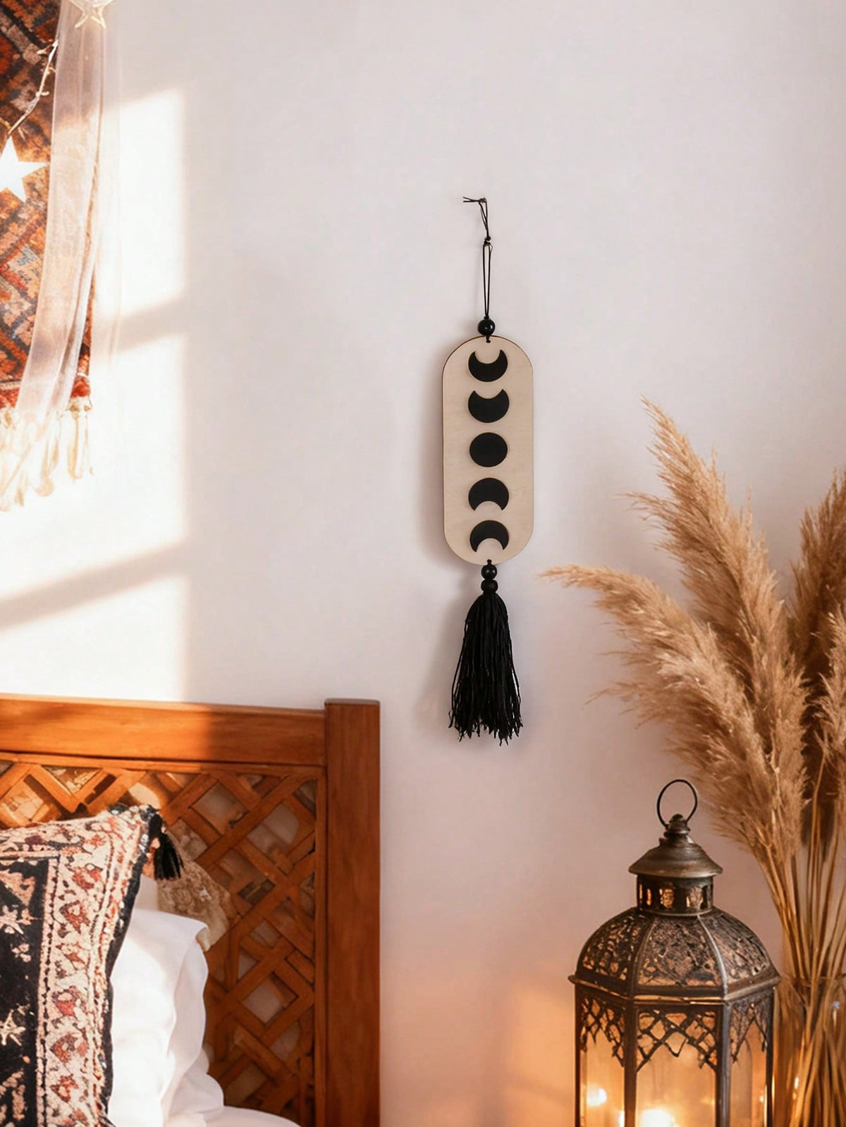 crescent moon phase tassel wall hanging styled in a room, photo 6