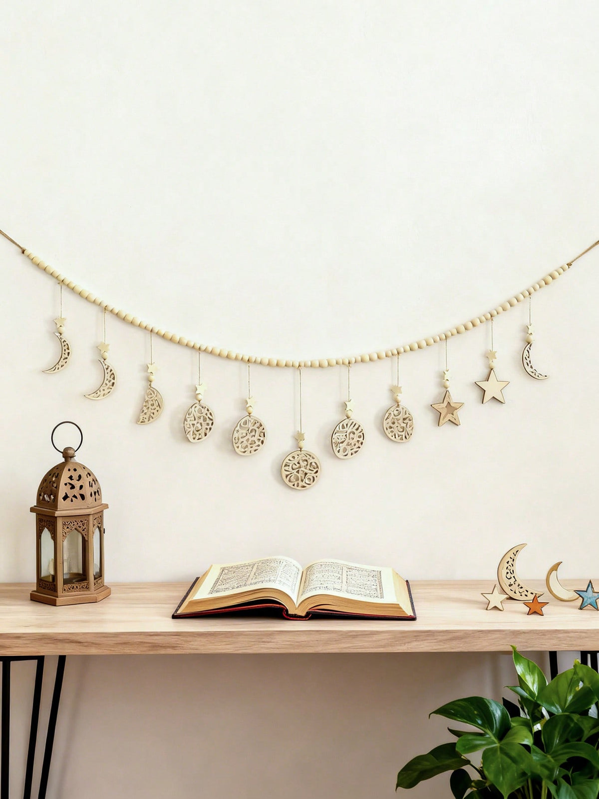 beaded filigree crescent moon garland styled in a room, photo 4