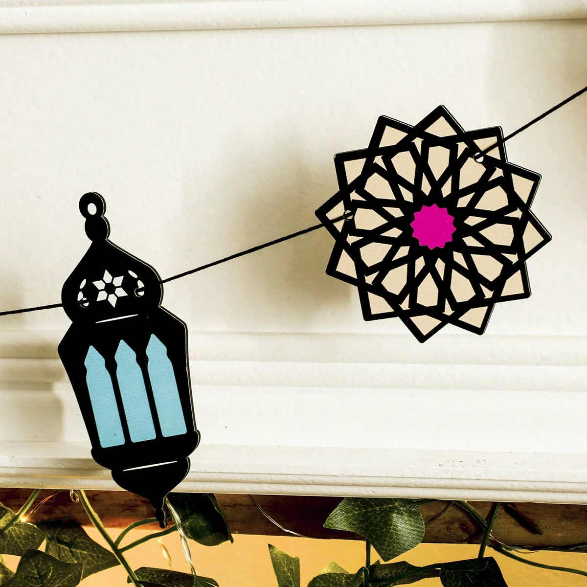 lantern crescent and star garland styled in a room, photo 6