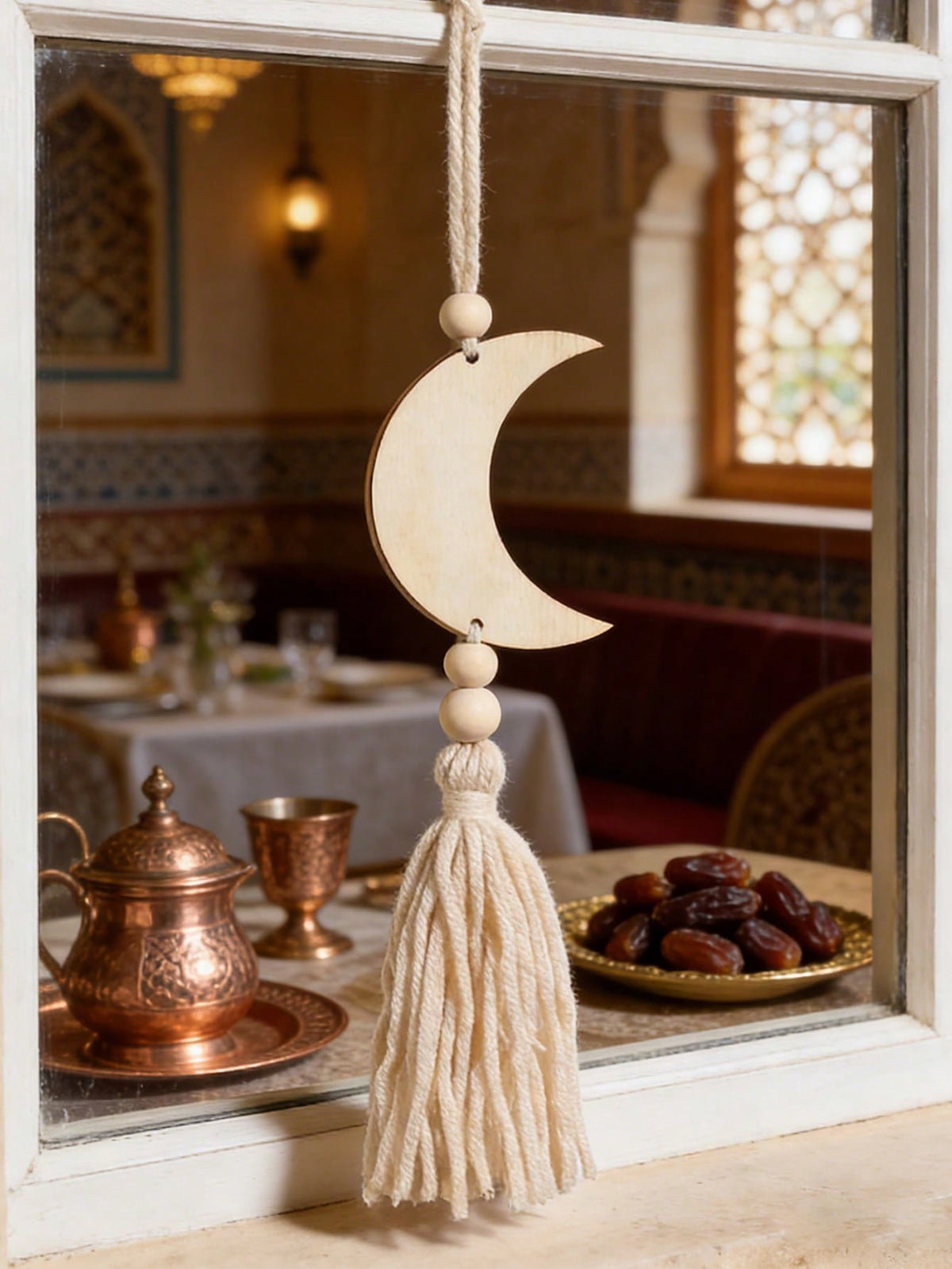 crescent moon and star tassel wall hanging styled in a room, photo 5