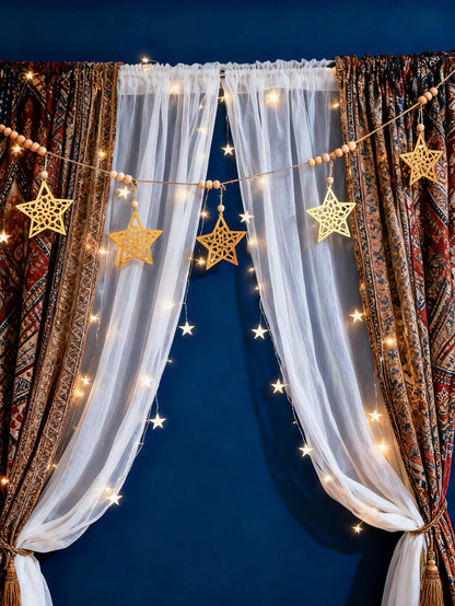 gold cutout star garland styled in a room, photo 6