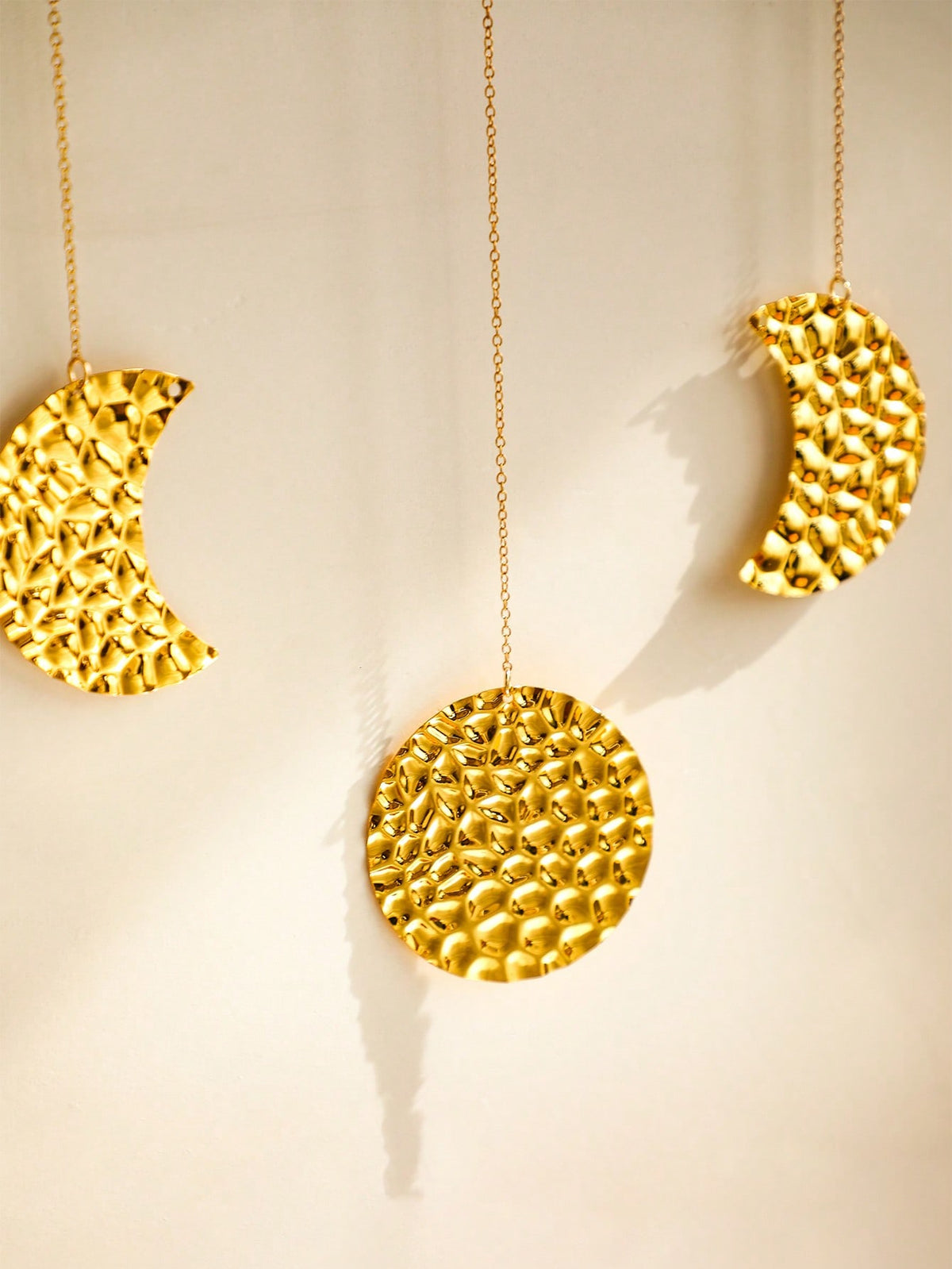 gold moon phase garland styled in a room, photo 7