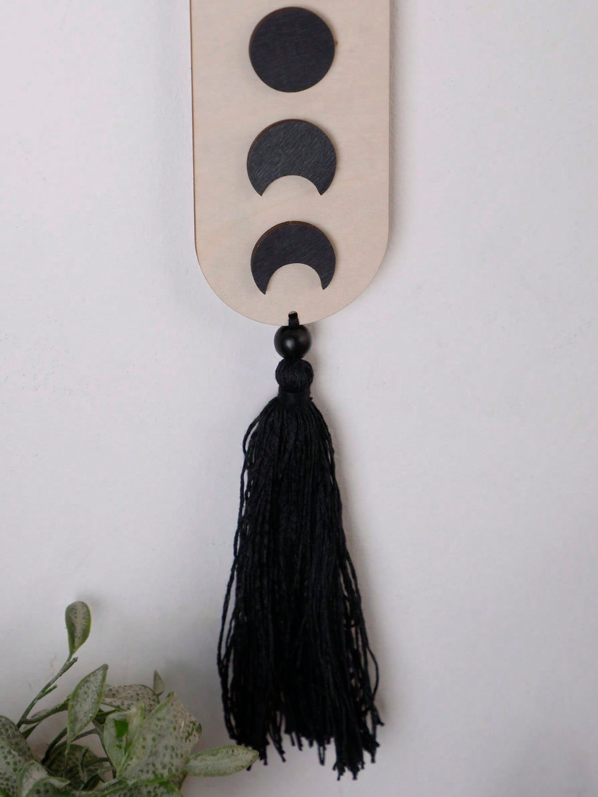 crescent moon phase tassel wall hanging styled in a room, photo 7