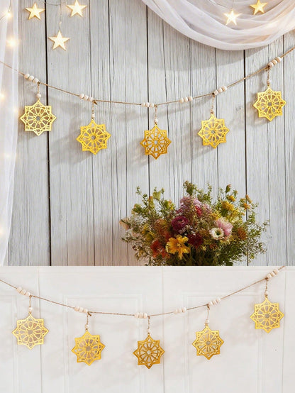 gold eight-point star garland styled in a room, photo 5