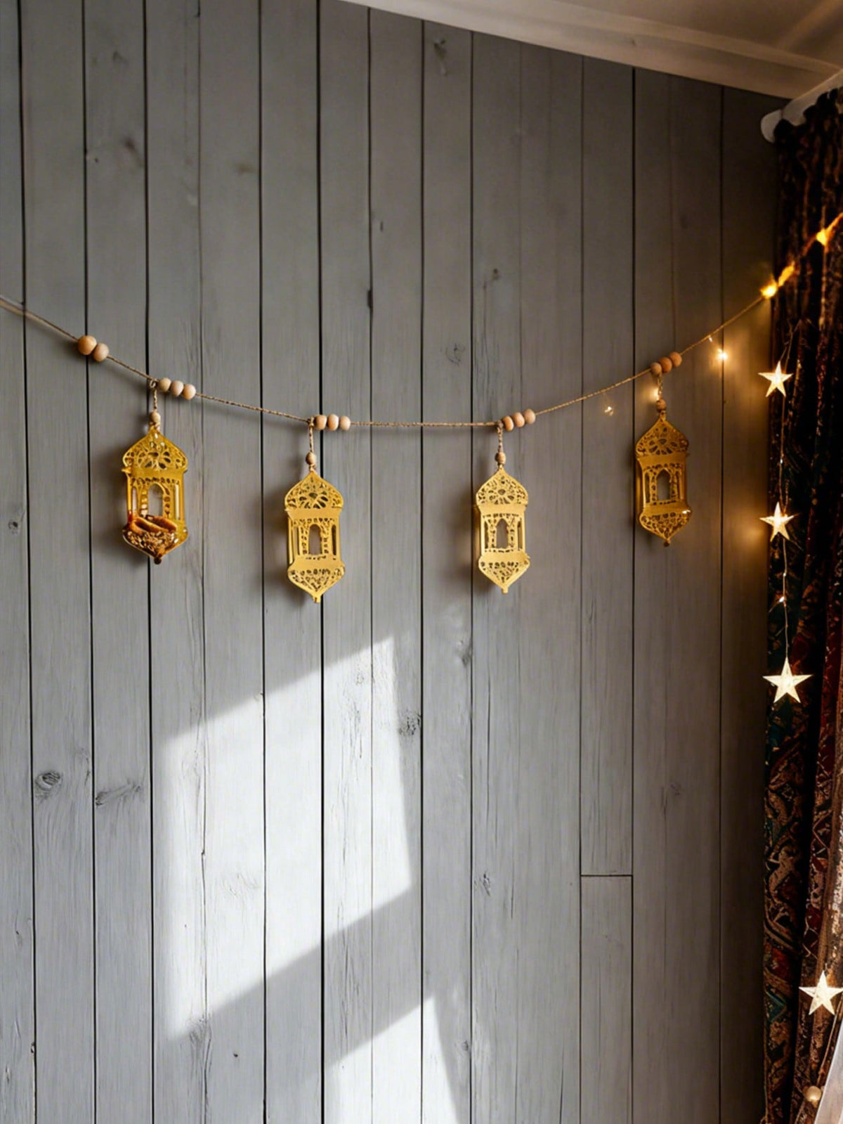gold geometric lantern garland styled in a room, photo 7