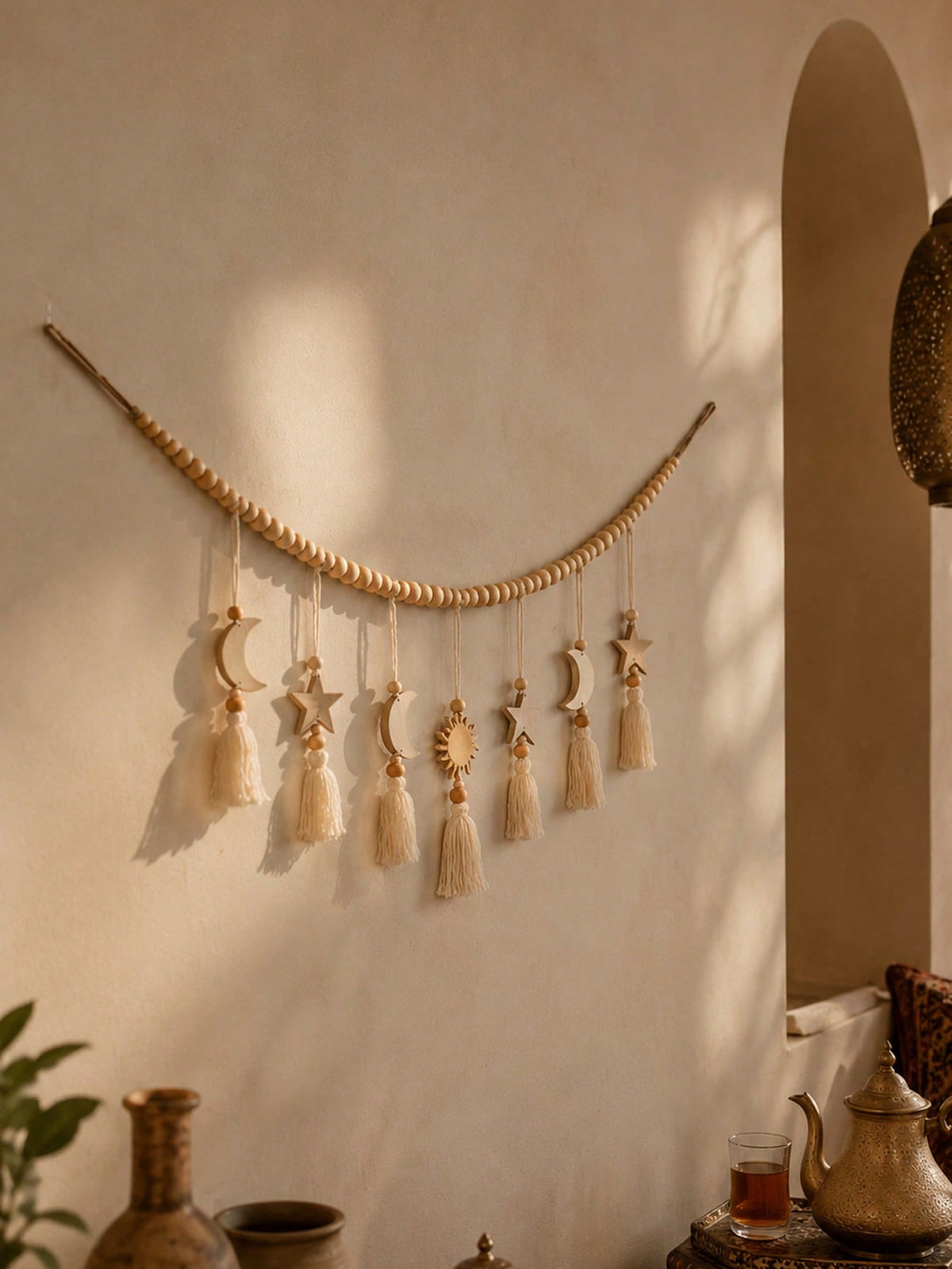 crescent moon sun and star tassel garland styled in a room, photo 7