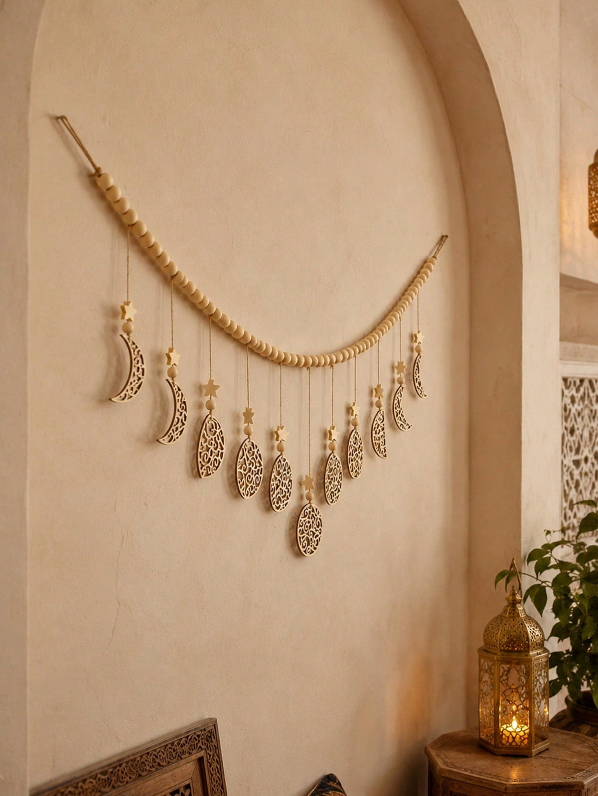 beaded filigree crescent moon garland styled in a room, photo 6
