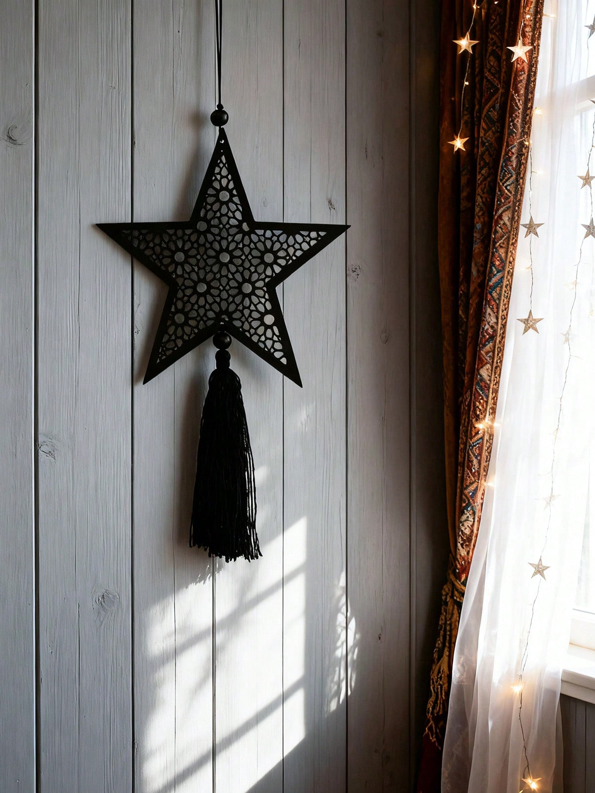filigree star tassel wall hanging styled in a room, photo 7