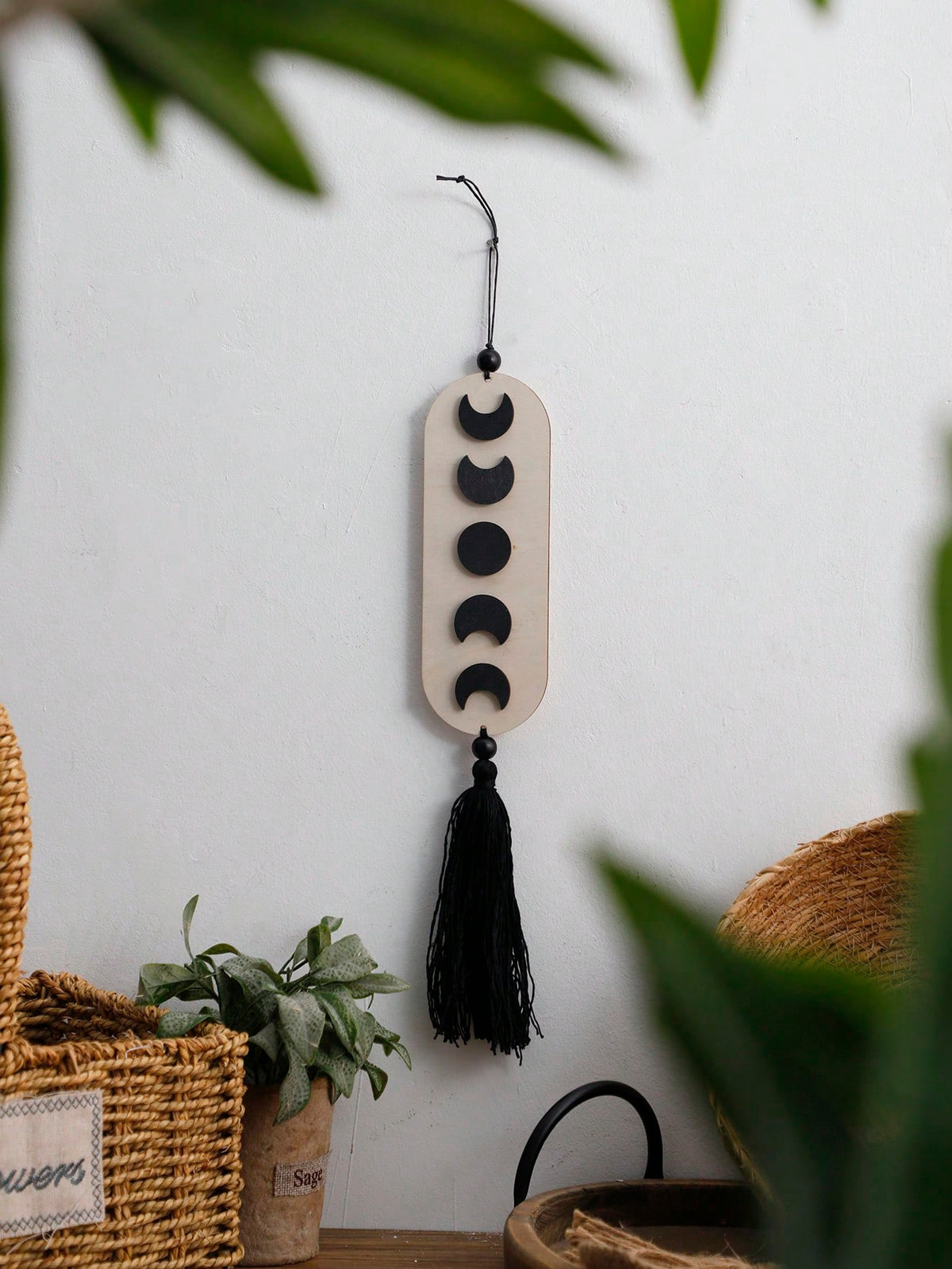 crescent moon phase tassel wall hanging styled in a room, photo 8