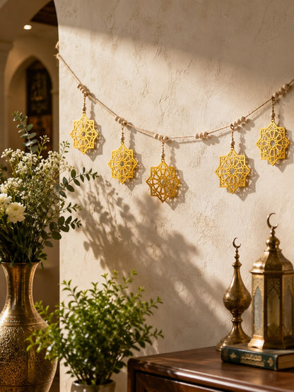 gold eight-point star garland styled in a room, photo 6
