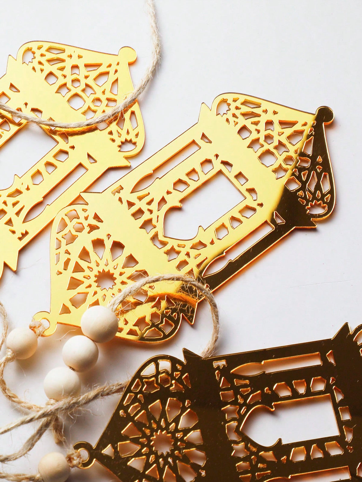 gold geometric lantern garland styled in a room, photo 8