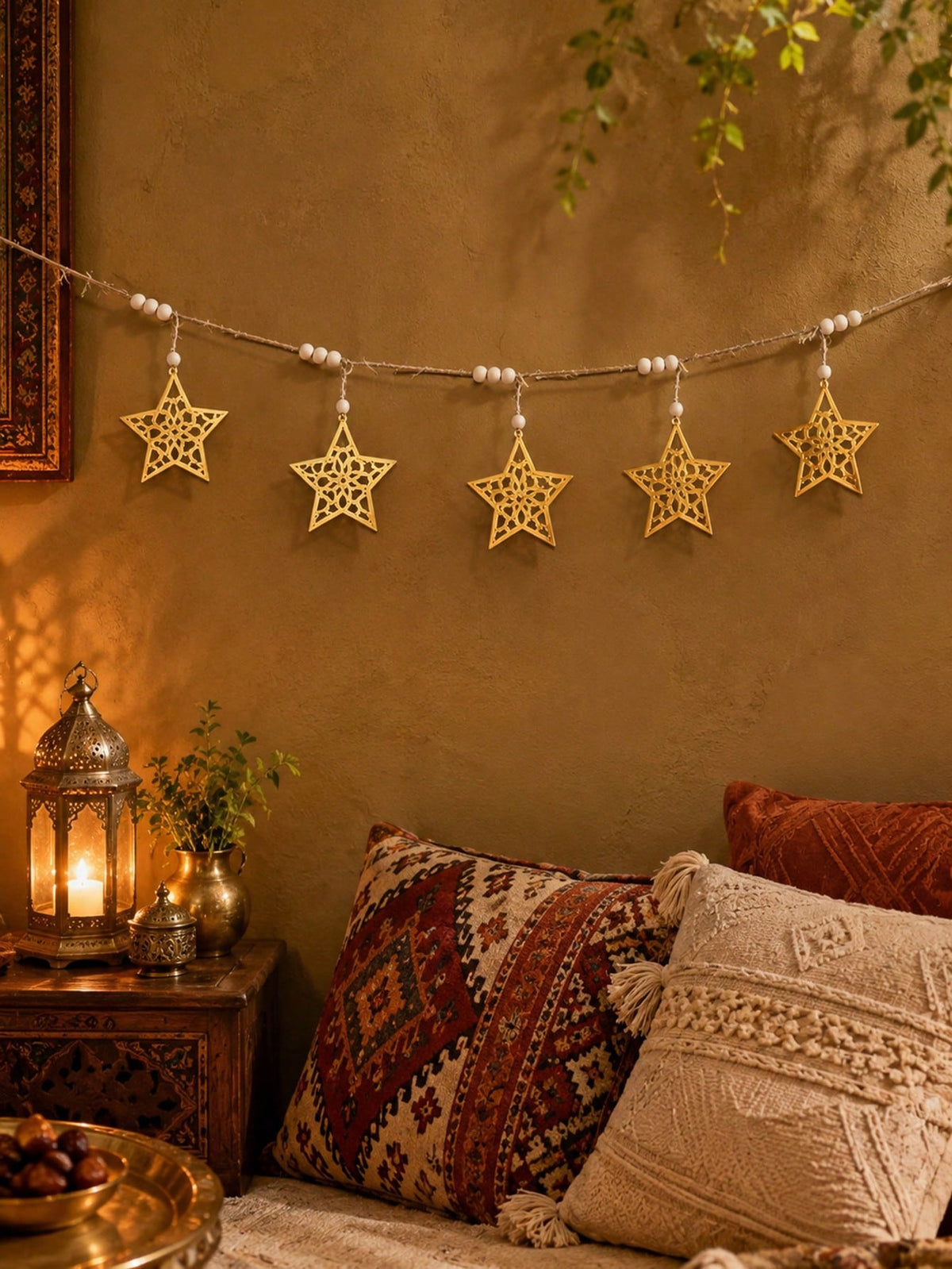 gold cutout star garland styled in a room, photo 8