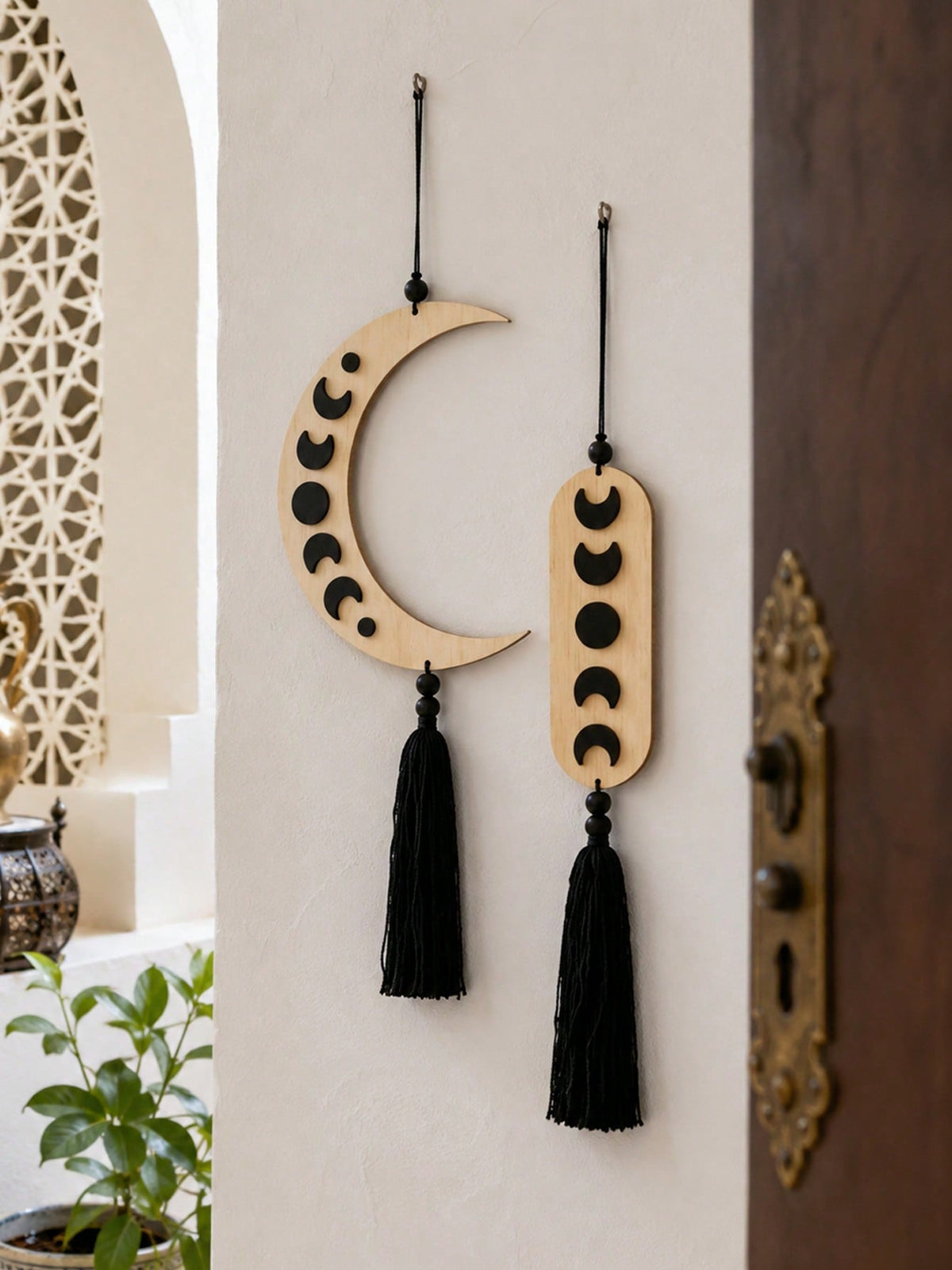 crescent moon phase tassel wall hanging styled in a room, photo 9