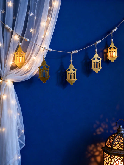 gold filigree lantern garland styled in a room, photo 7
