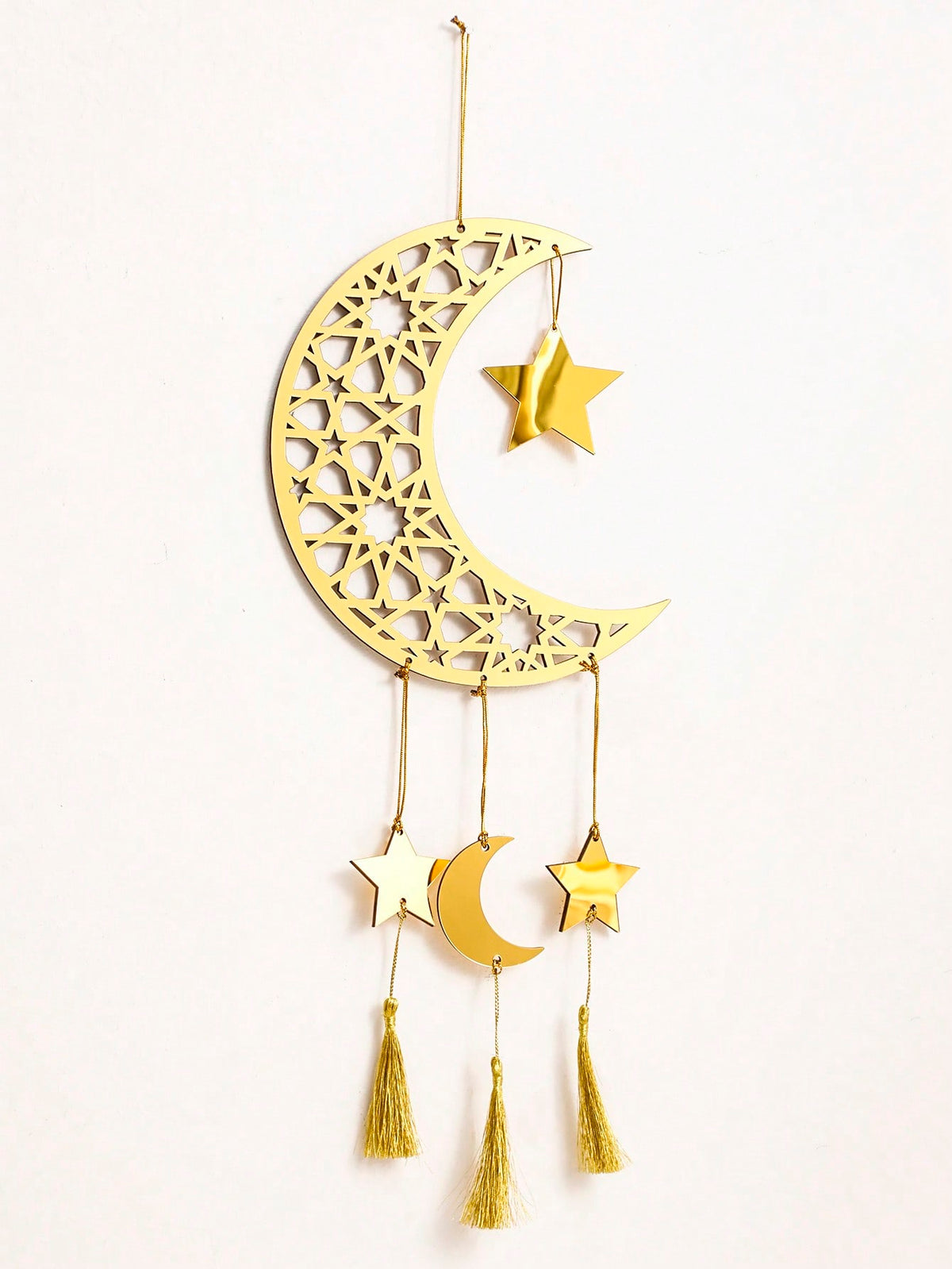 crescent moon star wall hanging with tassels styled in a room, photo 9