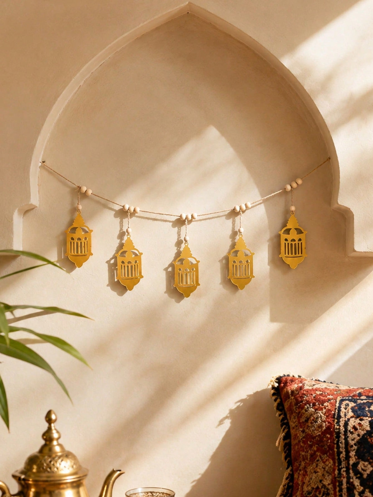 gold filigree lantern garland styled in a room, photo 8