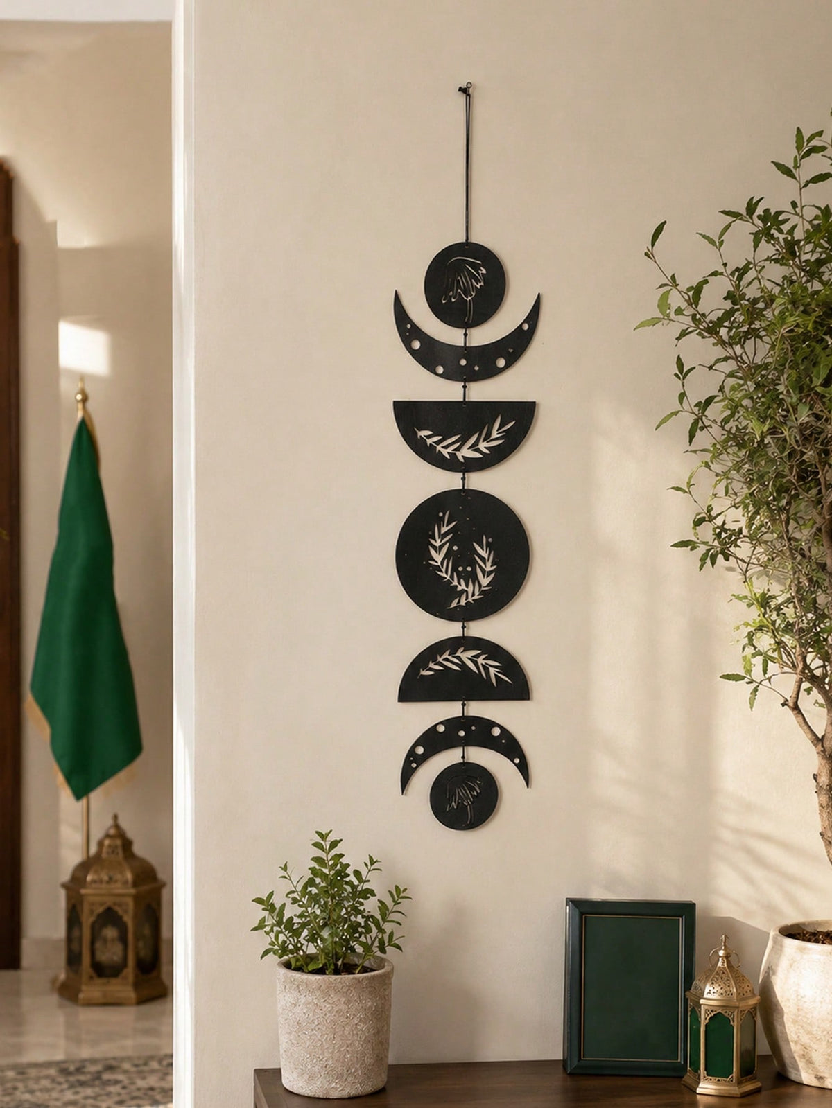 moon phase olive branch wall hanging styled in a room, photo 6