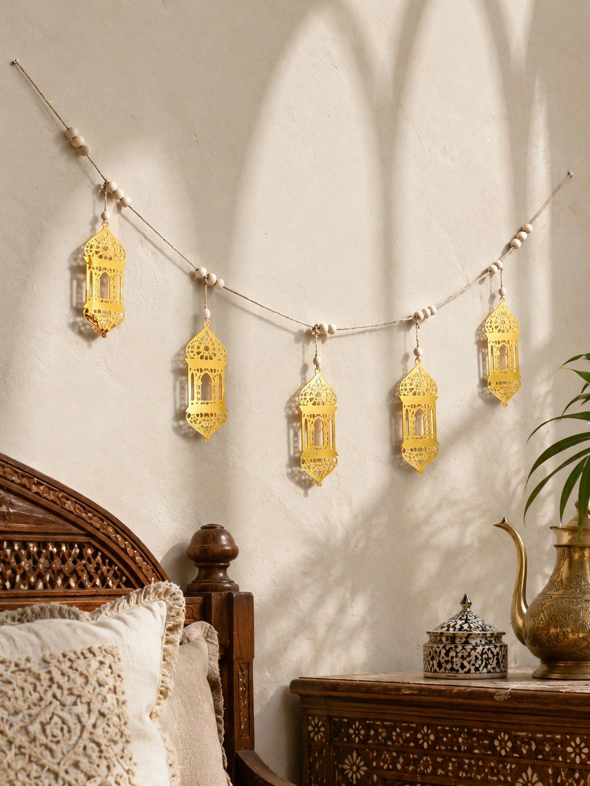 gold geometric lantern garland styled in a room, photo 9