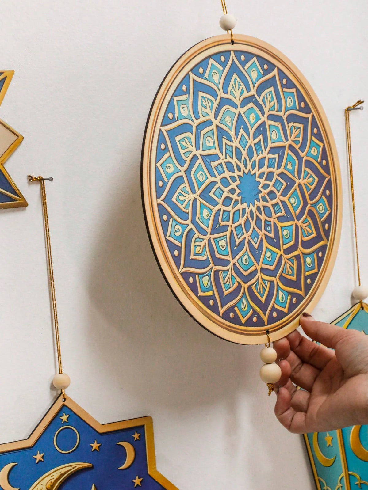 geometric star and crescent hanging ornaments styled in a room, photo 8