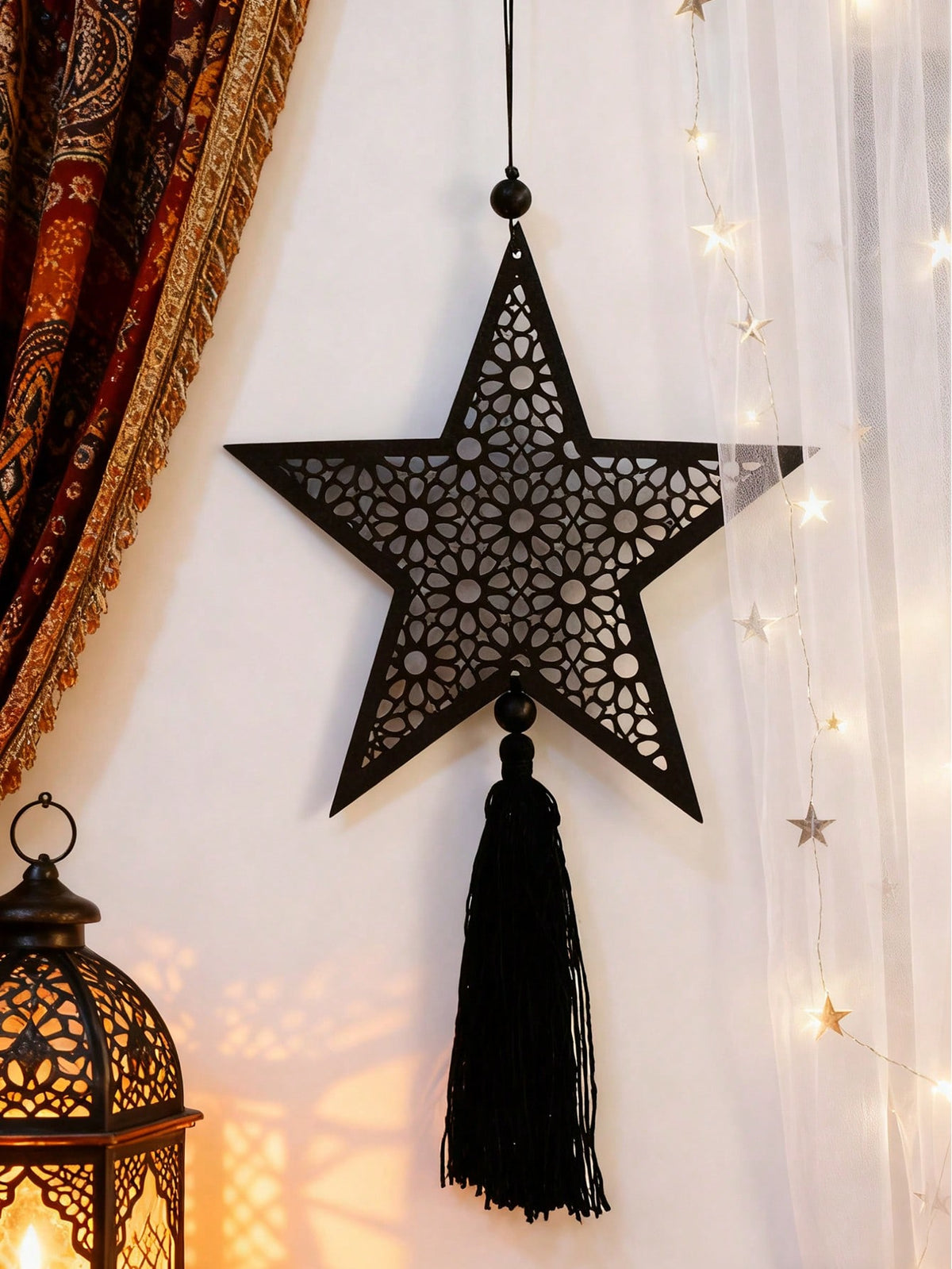 filigree star tassel wall hanging