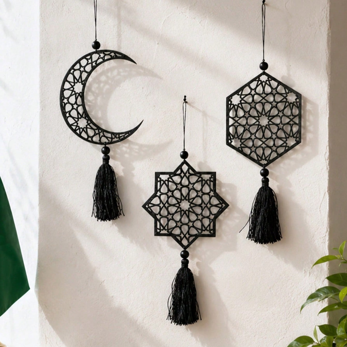 crescent moon and geometric star tassel hanging styled in a room, photo 9