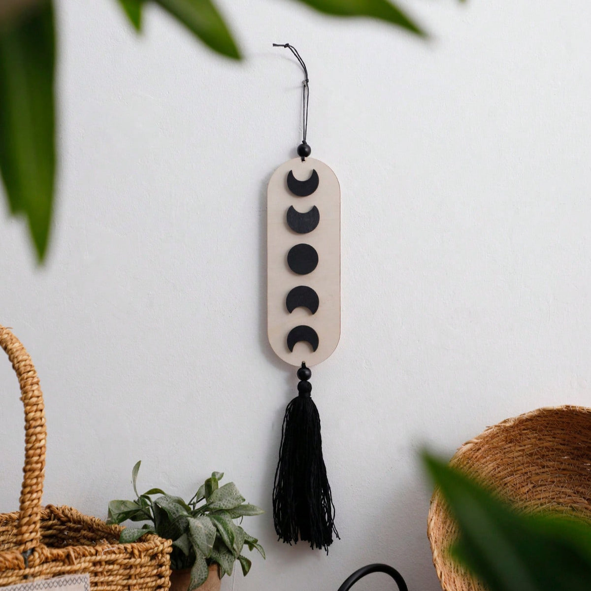 crescent moon phase tassel wall hanging styled in a room, photo 2