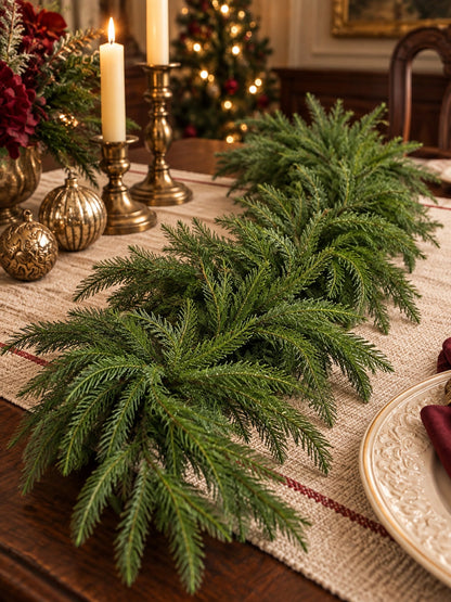 Artificial cedar Christmas swag on a holiday dining table