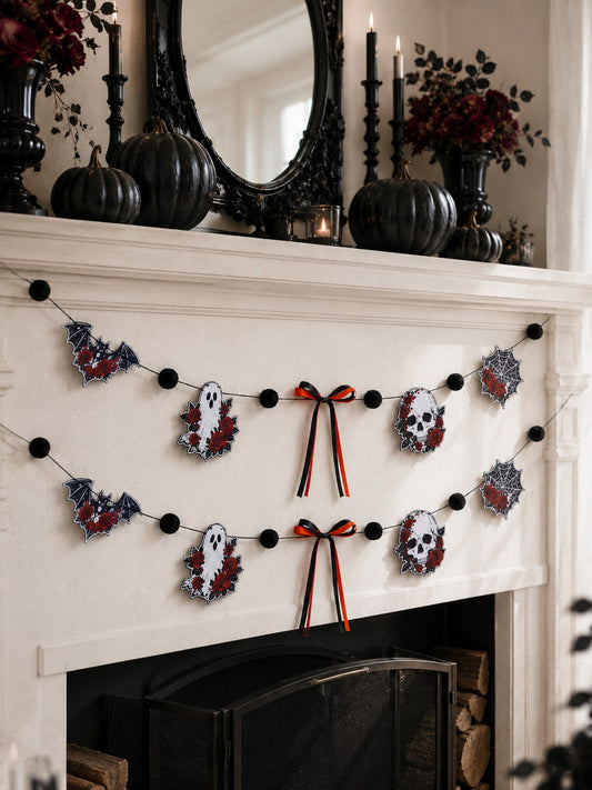 Gothic skull Halloween garland with roses on a white fireplace mantel