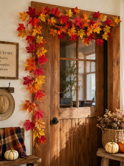 Fall maple leaf garland framing a wooden front door