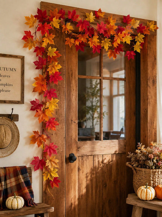 Fall maple leaf garland framing a wooden front door