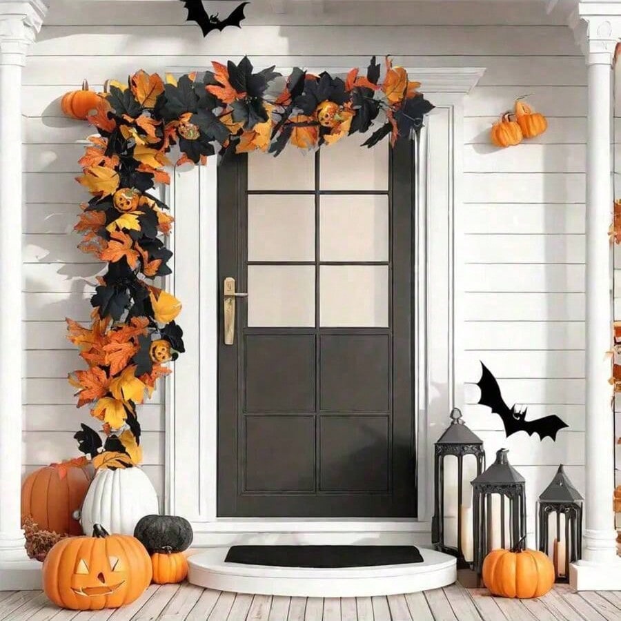 Halloween maple leaf garland framing a white front door