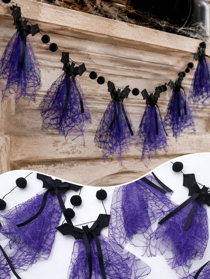 Purple bat Halloween banner on a mantel with tulle close-up