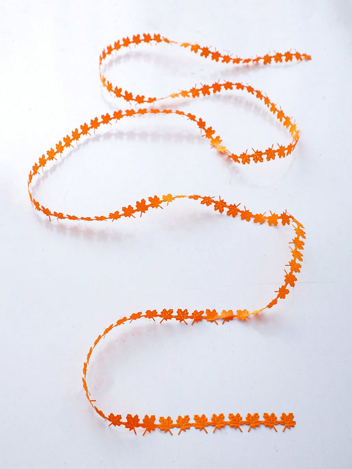 Maple leaf fairy string lights orange, unlit on white